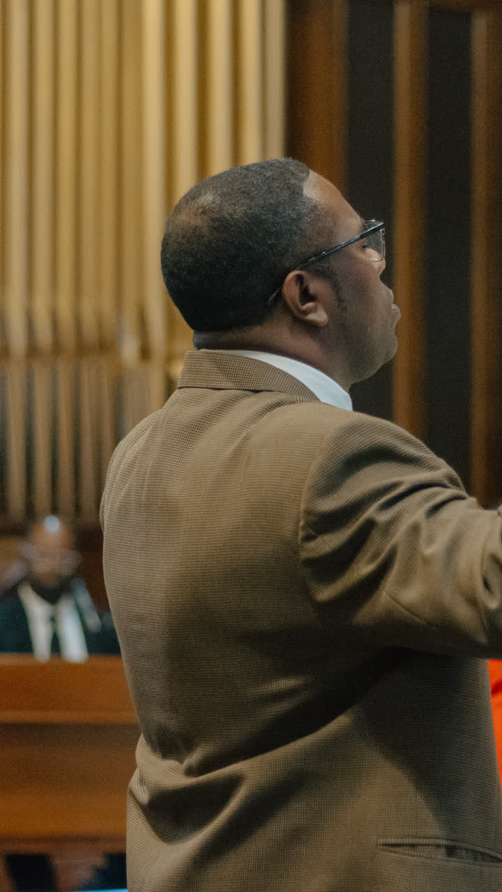 A man worshiping with his hand raised
